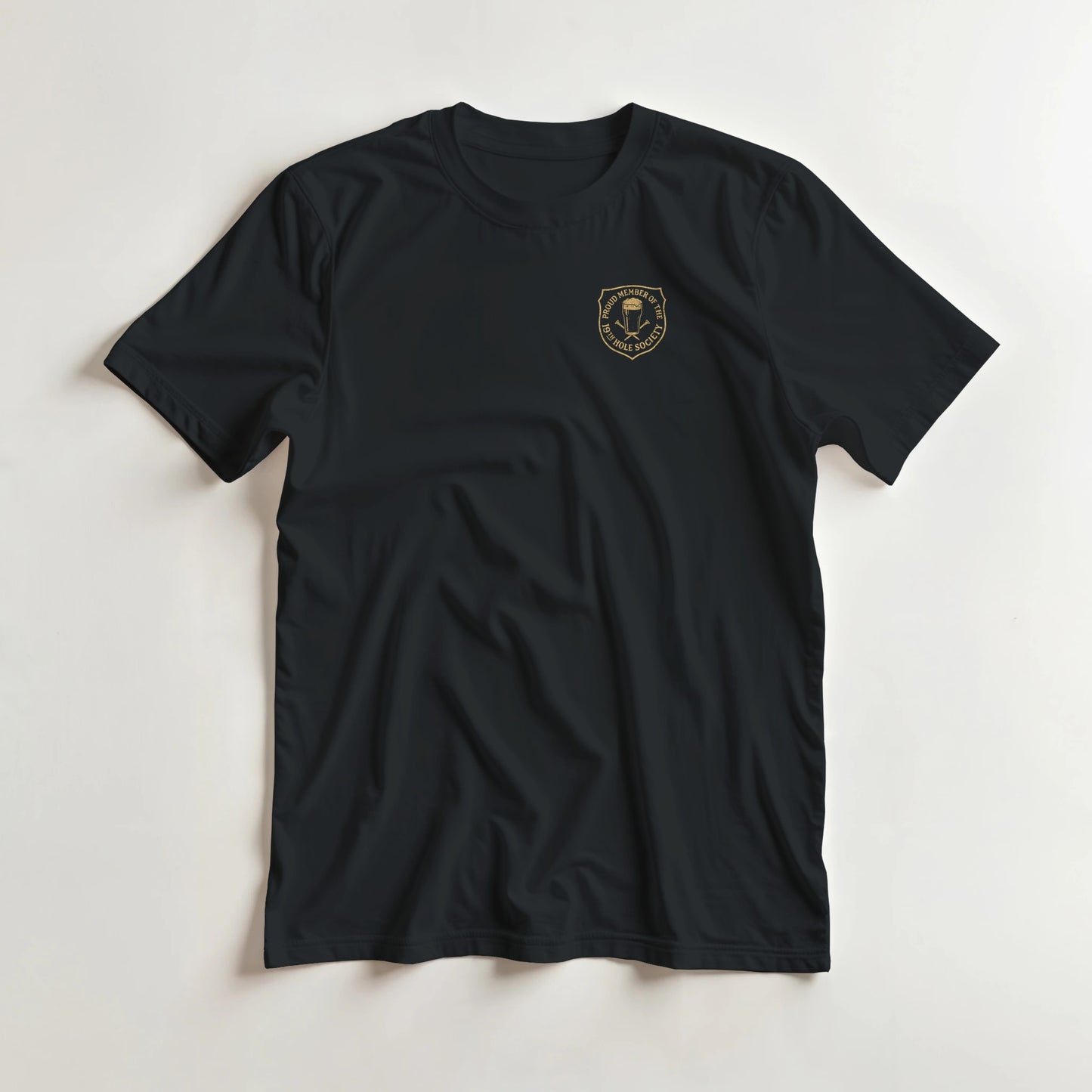 19th Hole T-Shirt in Black 2XL lying on a plain floor. T-shirt is a unisex cut and 100 per cent cotton.