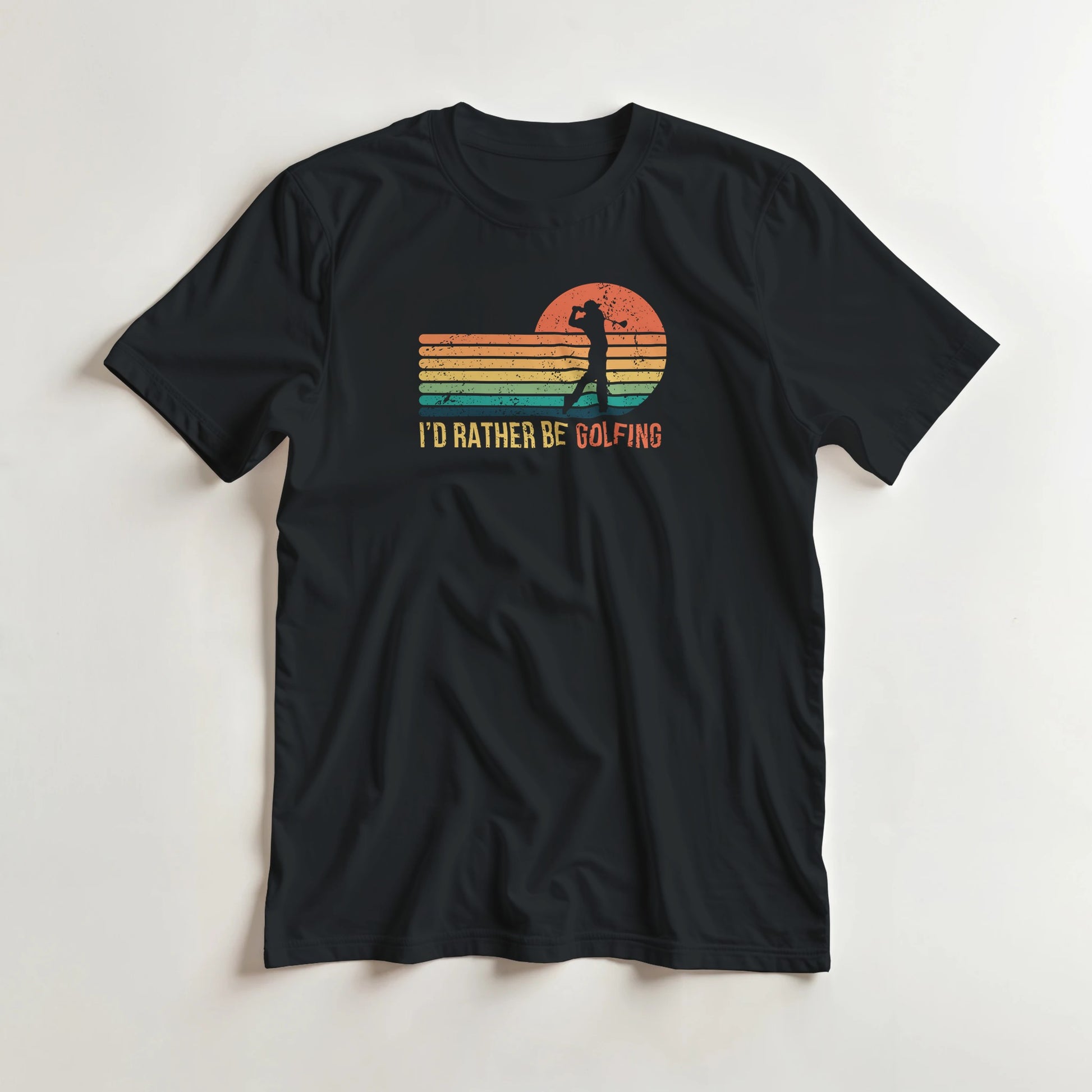 Rather Be Golfing T-Shirt in Black S lying on a plain floor. T-shirt is a unisex cut and 100 per cent cotton.