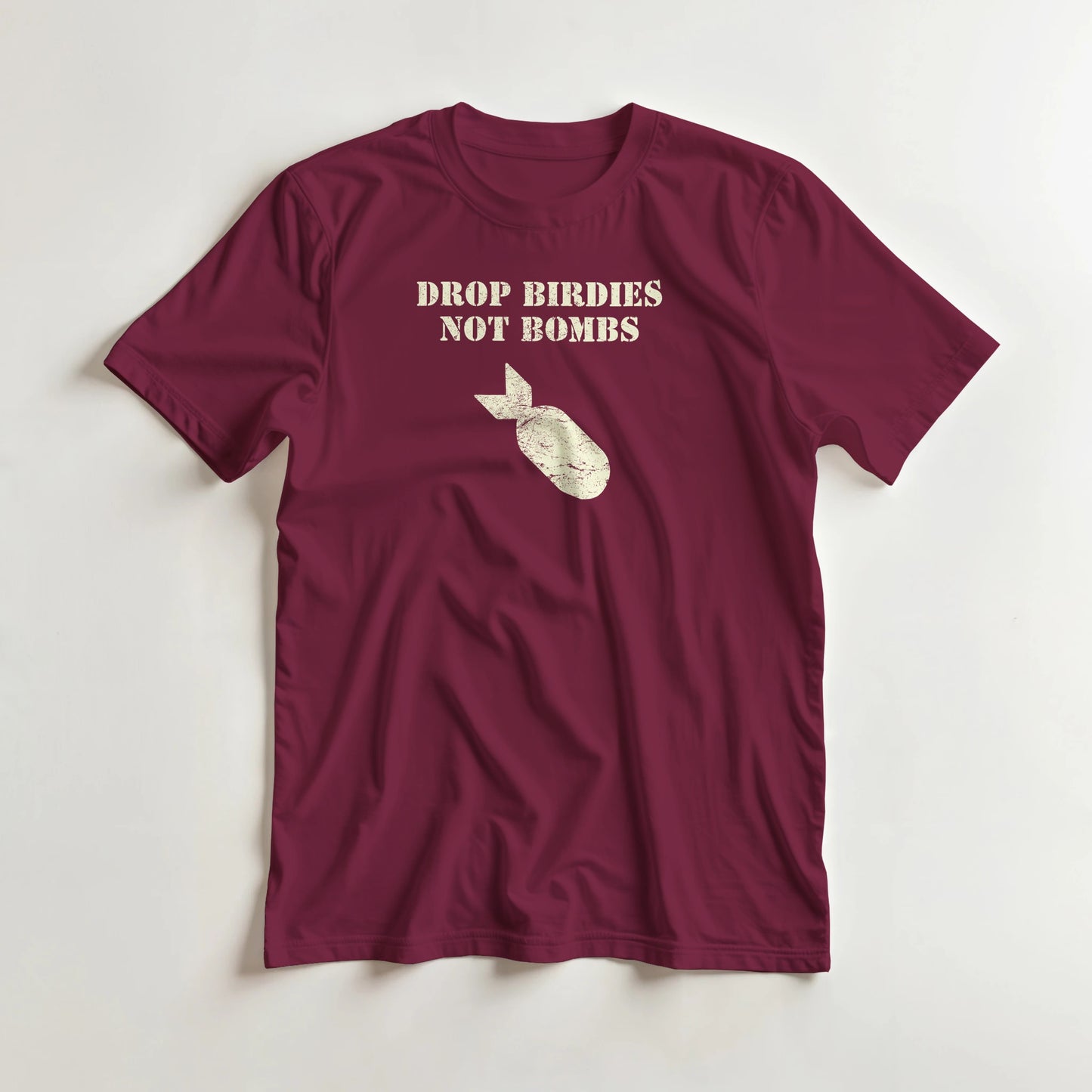 Drop Birdies T-Shirt in Maroon S lying on a plain floor. T-shirt is a unisex cut and 100 per cent cotton.