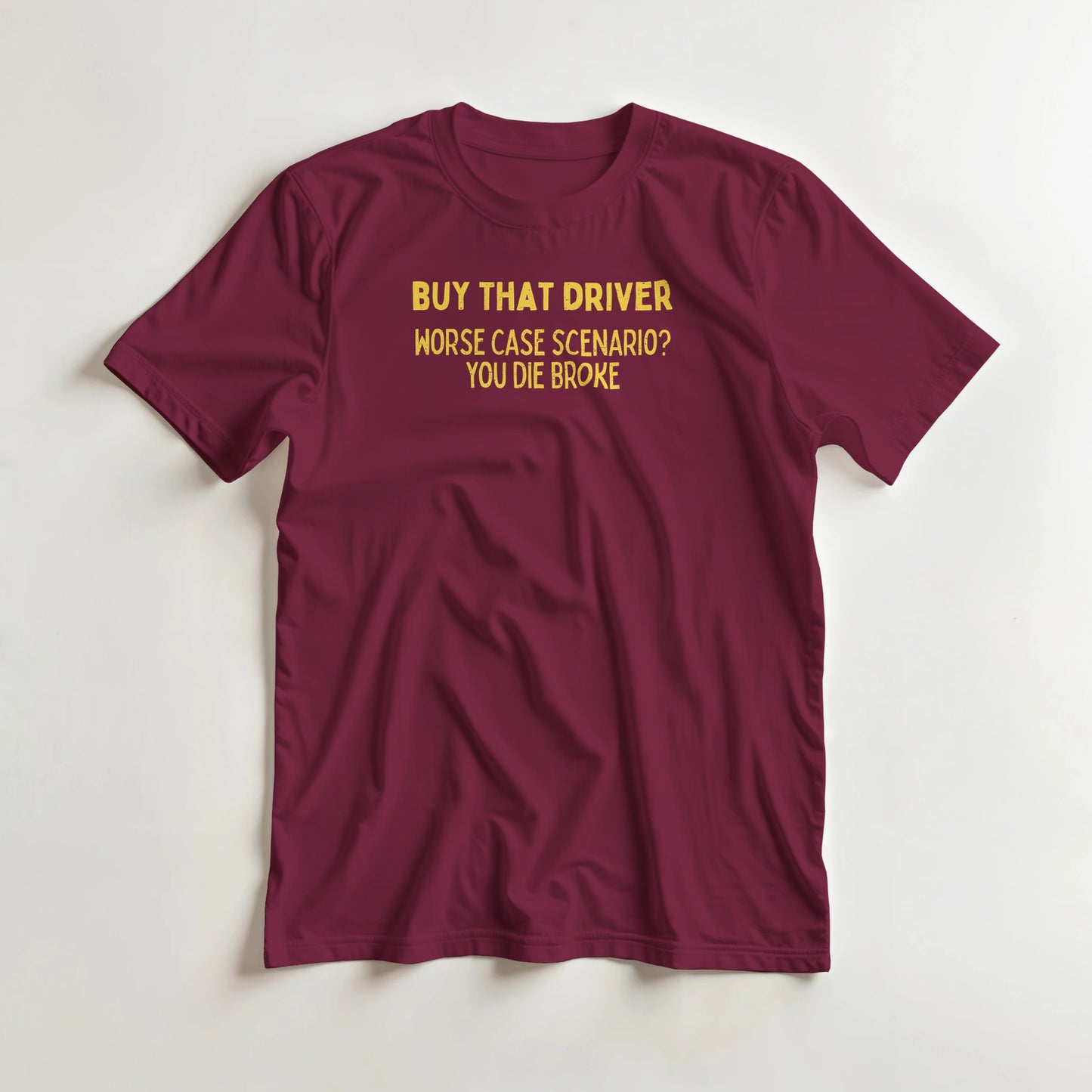Buy That Driver T-Shirt in Maroon lying on a plain floor. T-shirt is a unisex cut and 100 per cent cotton.