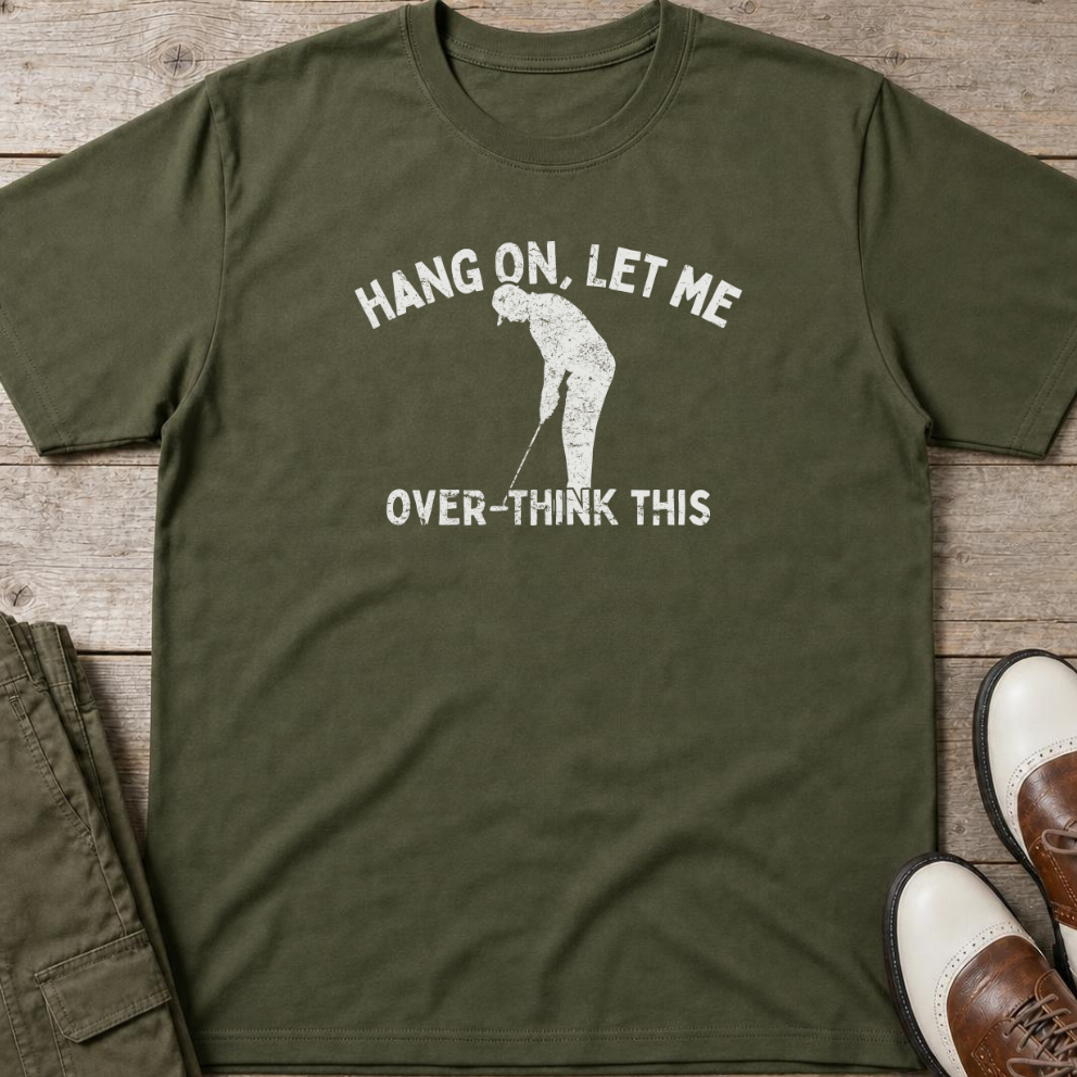 Over-Think T-Shirt in Military Green lying on a plain floor. T-shirt is a unisex cut and 100 per cent cotton.