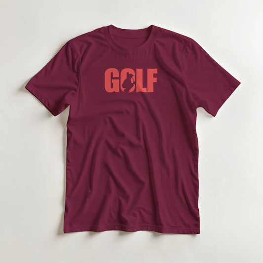 Golf C T-Shirt in Maroon lying on a plain floor. T-shirt is a unisex cut and 100 per cent cotton.