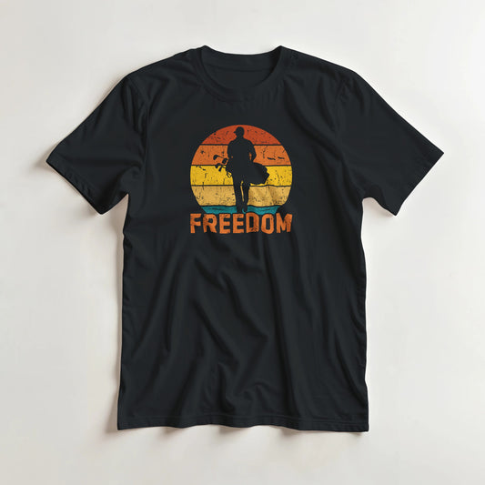 Freedom Golfer T-Shirt in lying on a plain floor. T-shirt is a unisex cut and 100 per cent cotton.
