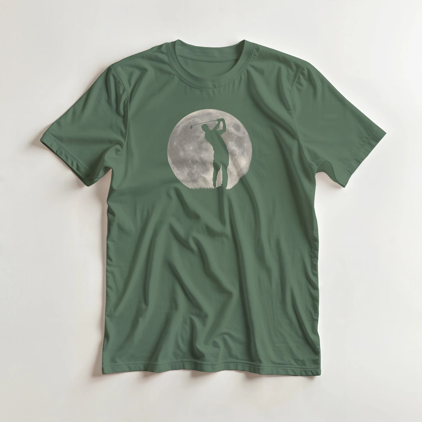 Moon Shot T-Shirt in Military Green M lying on a plain floor. T-shirt is a unisex cut and 100 per cent cotton.