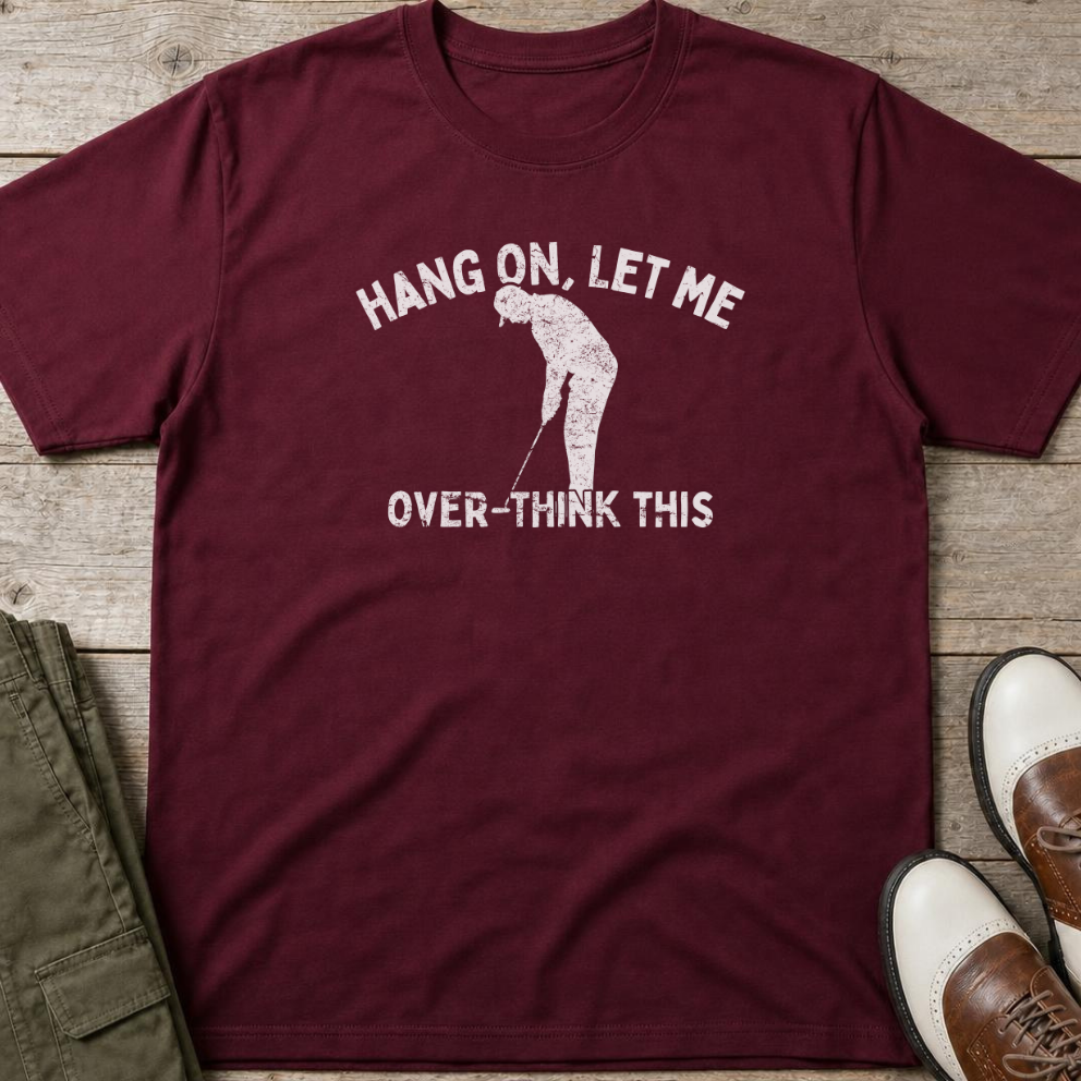 Over-Think T-Shirt in Maroon lying on a plain floor. T-shirt is a unisex cut and 100 per cent cotton.