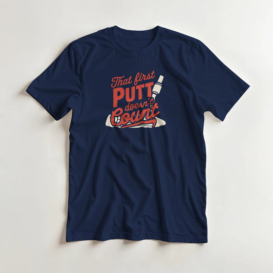 First Putt T-Shirt in Navy lying on a plain floor. T-shirt is a unisex cut and 100 per cent cotton.
