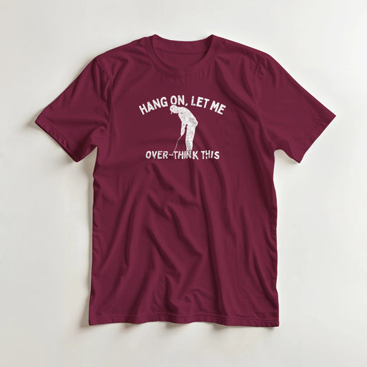 Over-Think T-Shirt in Maroon S lying on a plain floor. T-shirt is a unisex cut and 100 per cent cotton.