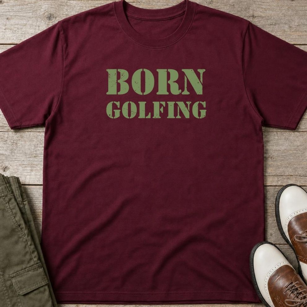 Born Golfing T-Shirt in Maroon lying on a plain floor. T-shirt is a unisex cut and 100 per cent cotton.