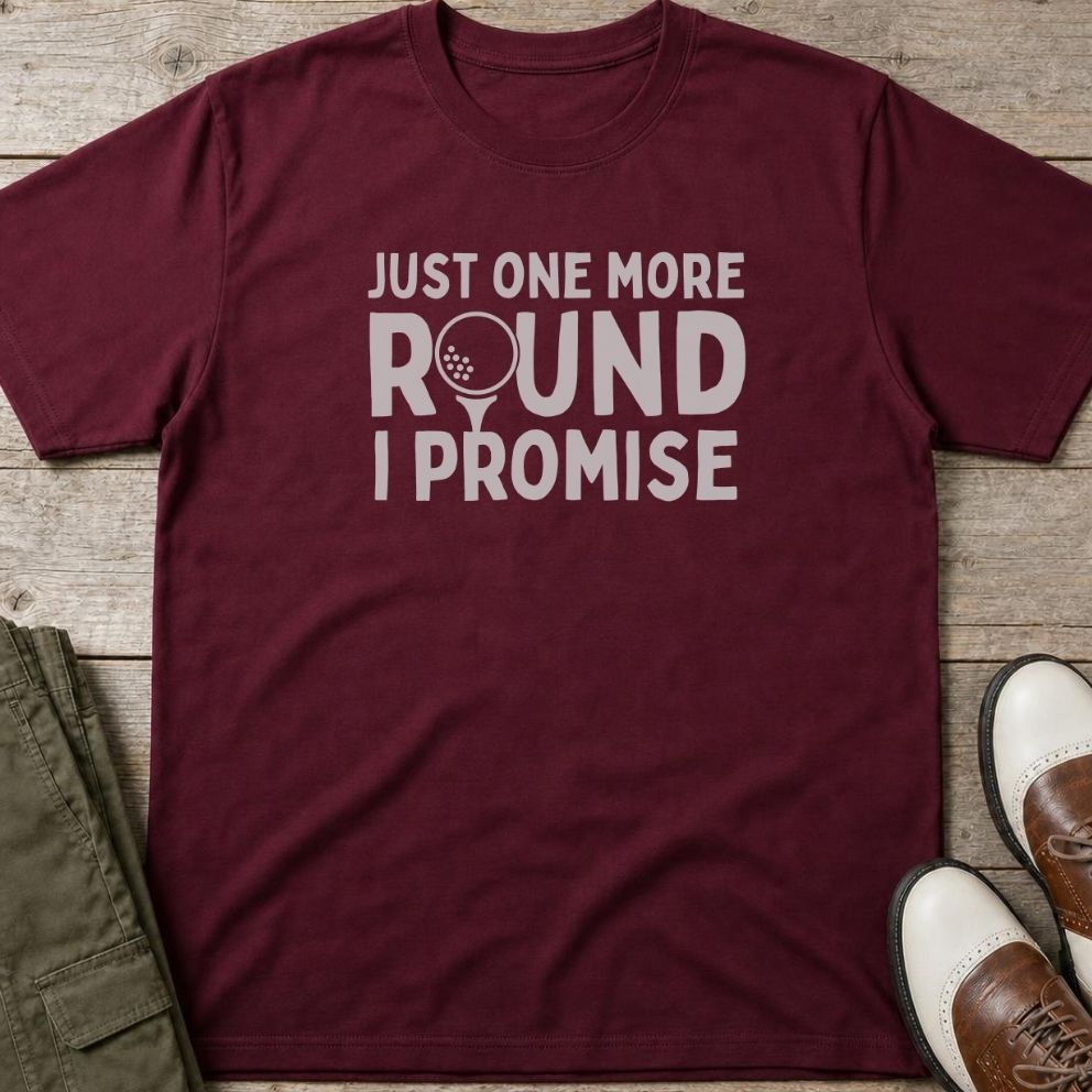 One More Round T-Shirt in Maroon lying on a plain floor. T-shirt is a unisex cut and 100 per cent cotton.