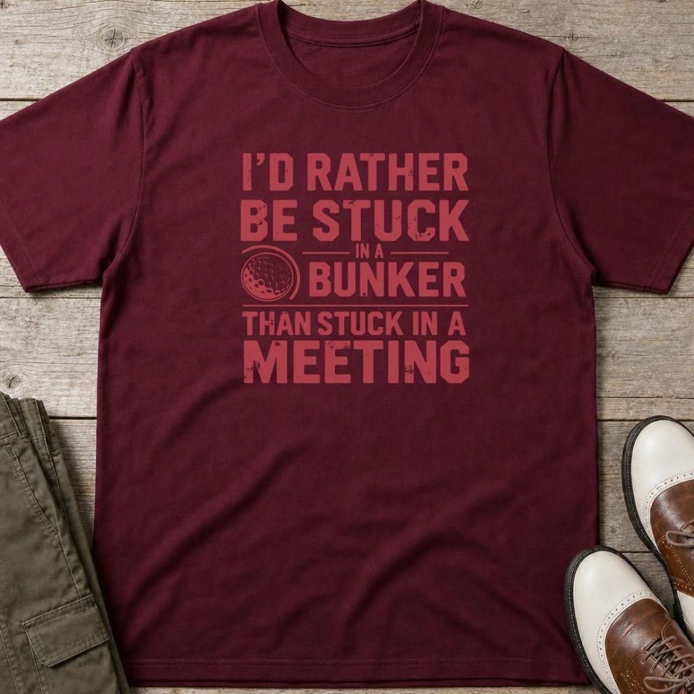 Stuck In Bunker T-Shirt in Maroon lying on a plain floor. T-shirt is a unisex cut and 100 per cent cotton.