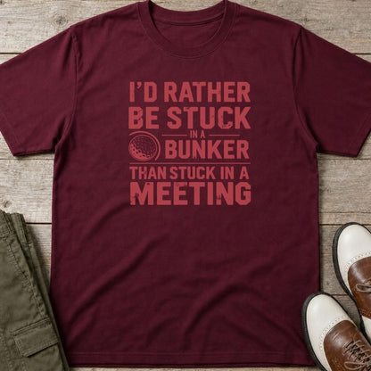 Stuck In Bunker T-Shirt in Maroon lying on a plain floor. T-shirt is a unisex cut and 100 per cent cotton.