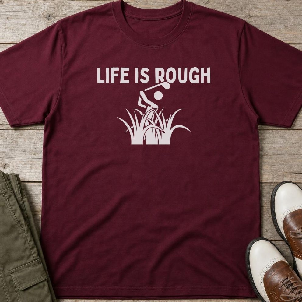 Life Is Rough T-Shirt in Maroon lying on a plain floor. T-shirt is a unisex cut and 100 per cent cotton.