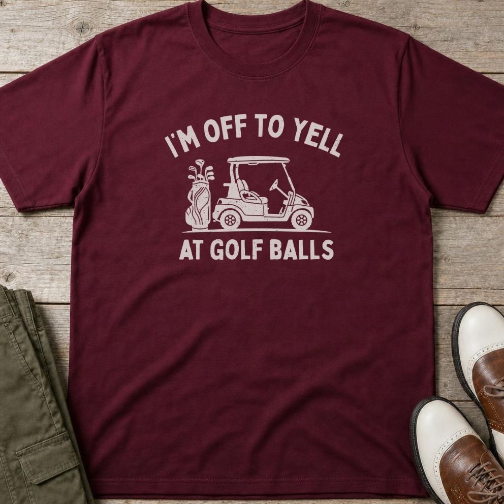 Off To Yell T-Shirt in Maroon lying on a plain floor. T-shirt is a unisex cut and 100 per cent cotton.