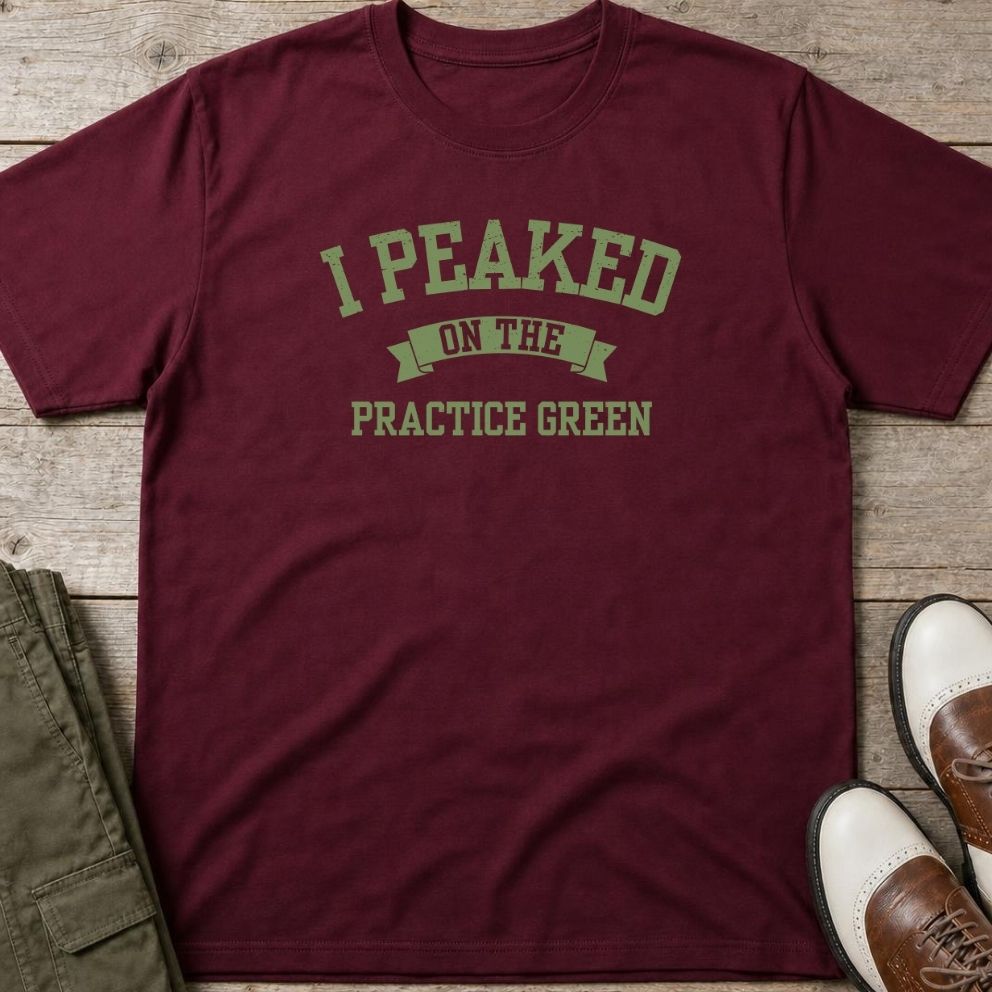 Practice Green T-Shirt in Maroon lying on a plain floor. T-shirt is a unisex cut and 100 per cent cotton.
