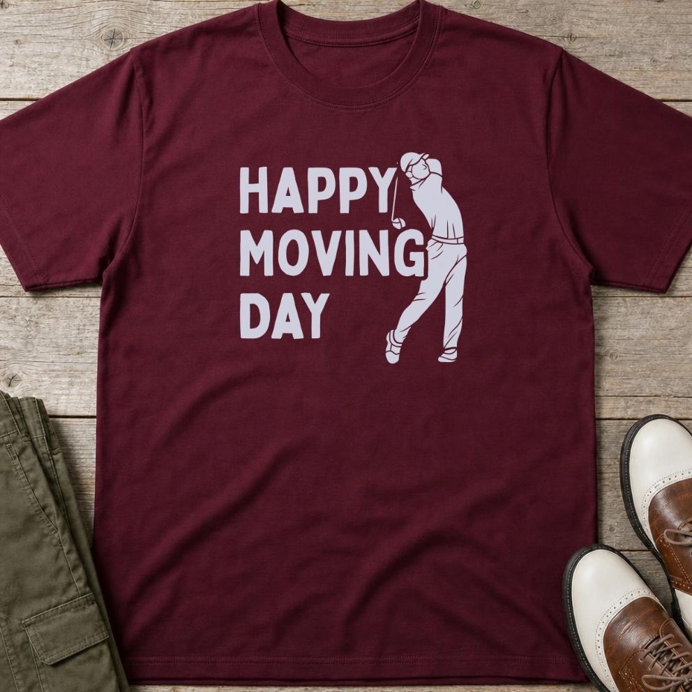 Happy Moving Day T-Shirt in Maroon lying on a plain floor. T-shirt is a unisex cut and 100 per cent cotton.