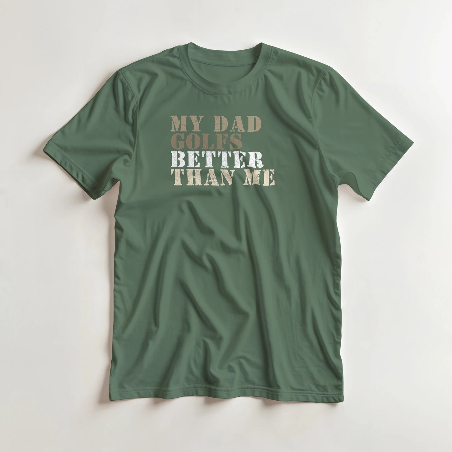 My Dad Golfs T-Shirt in Military Green lying on a plain floor. T-shirt is a unisex cut and 100 per cent cotton.