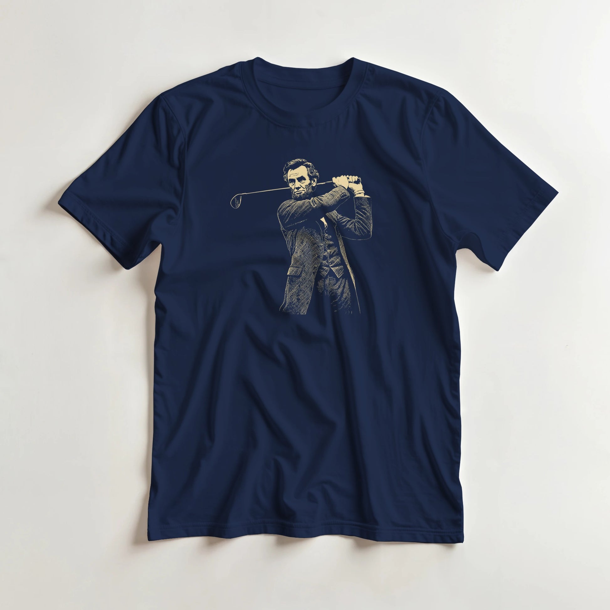 Lincoln On Course T-Shirt in Navy lying on a plain floor. T-shirt is a unisex cut and 100 per cent cotton.
