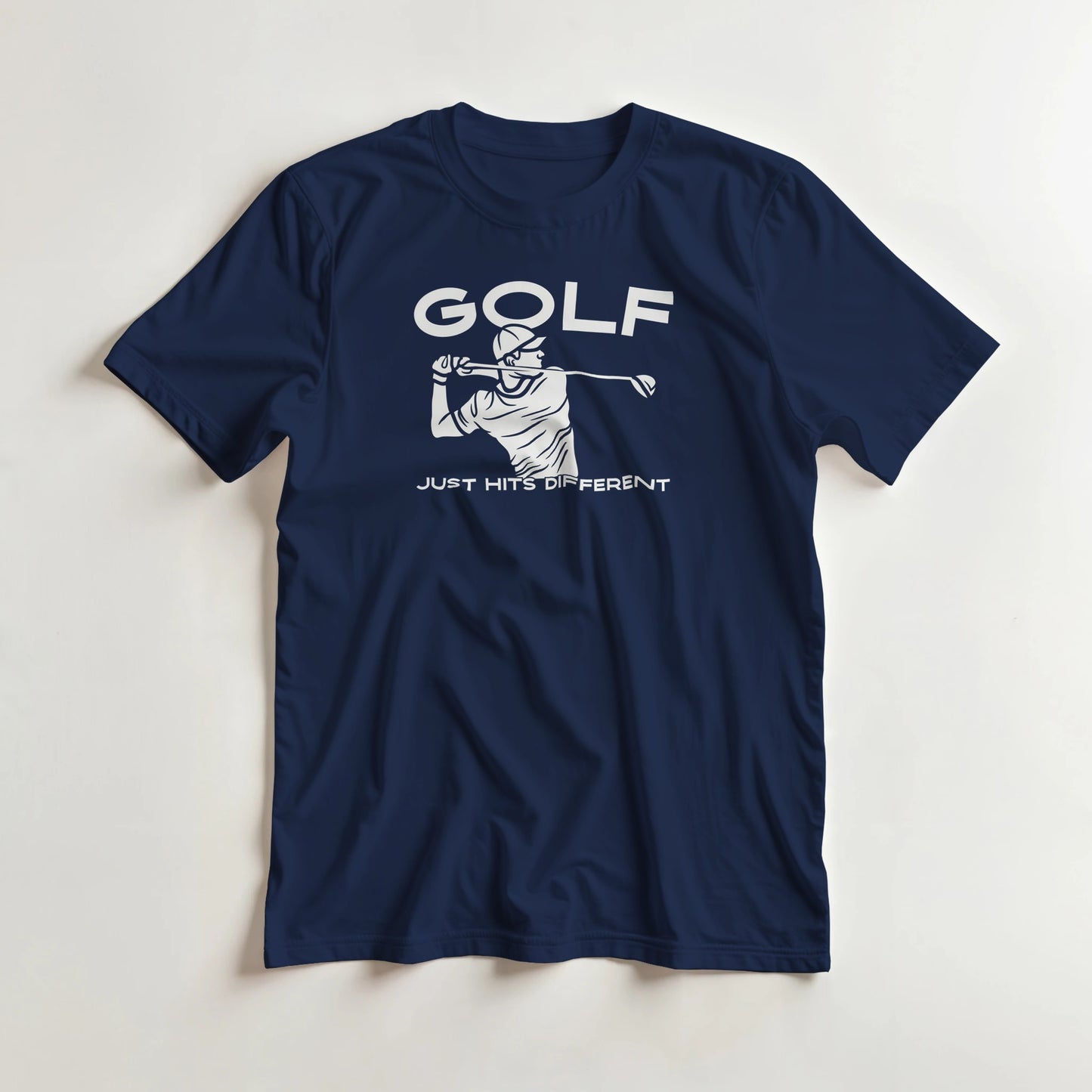 Hits Different T-Shirt in Navy L lying on a plain floor. T-shirt is a unisex cut and 100 per cent cotton.