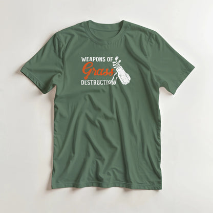 Weapons T-Shirt in Military Green M lying on a plain floor. T-shirt is a unisex cut and 100 per cent cotton.