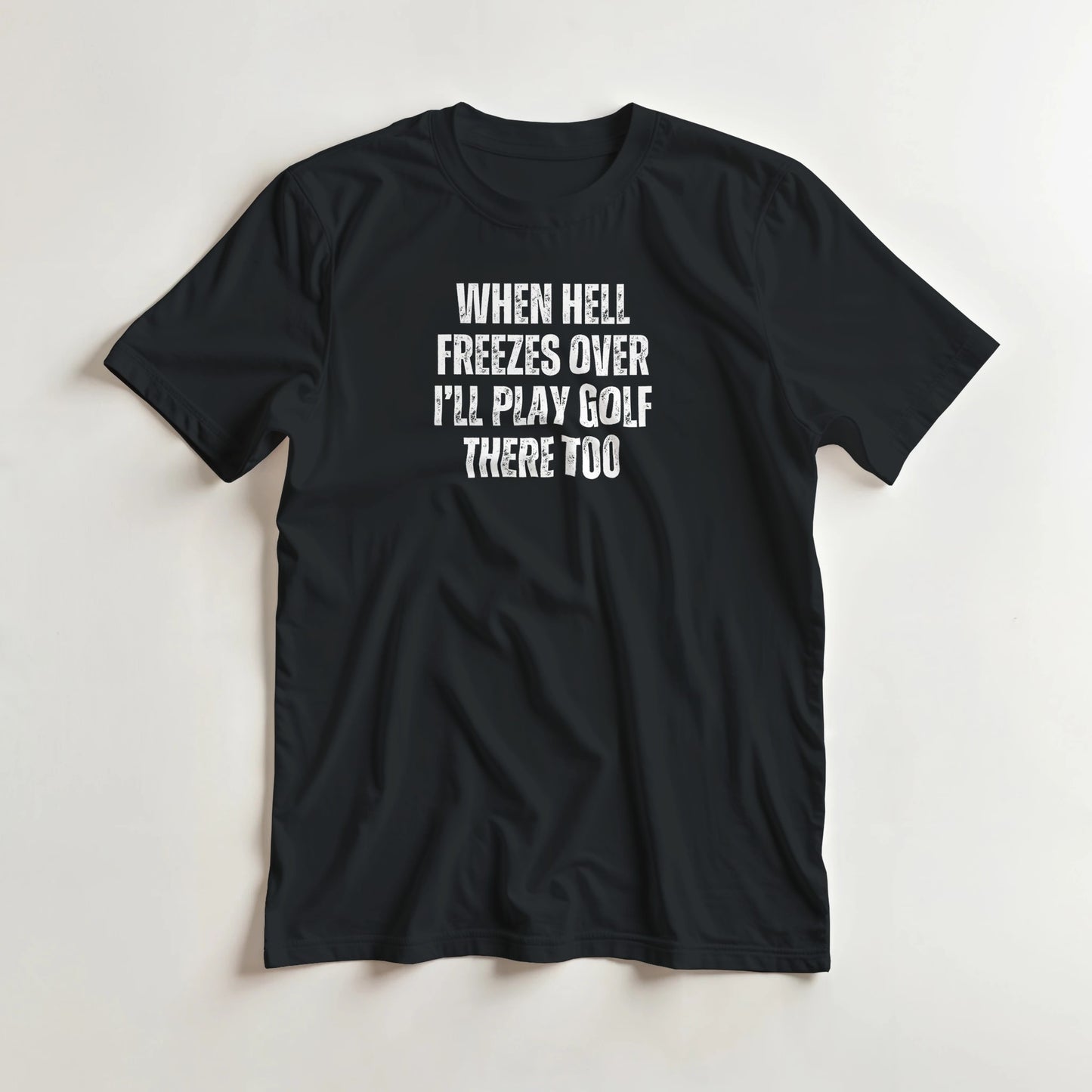 Hell Freezes T-Shirt in Black lying on a plain floor. T-shirt is a unisex cut and 100 per cent cotton.