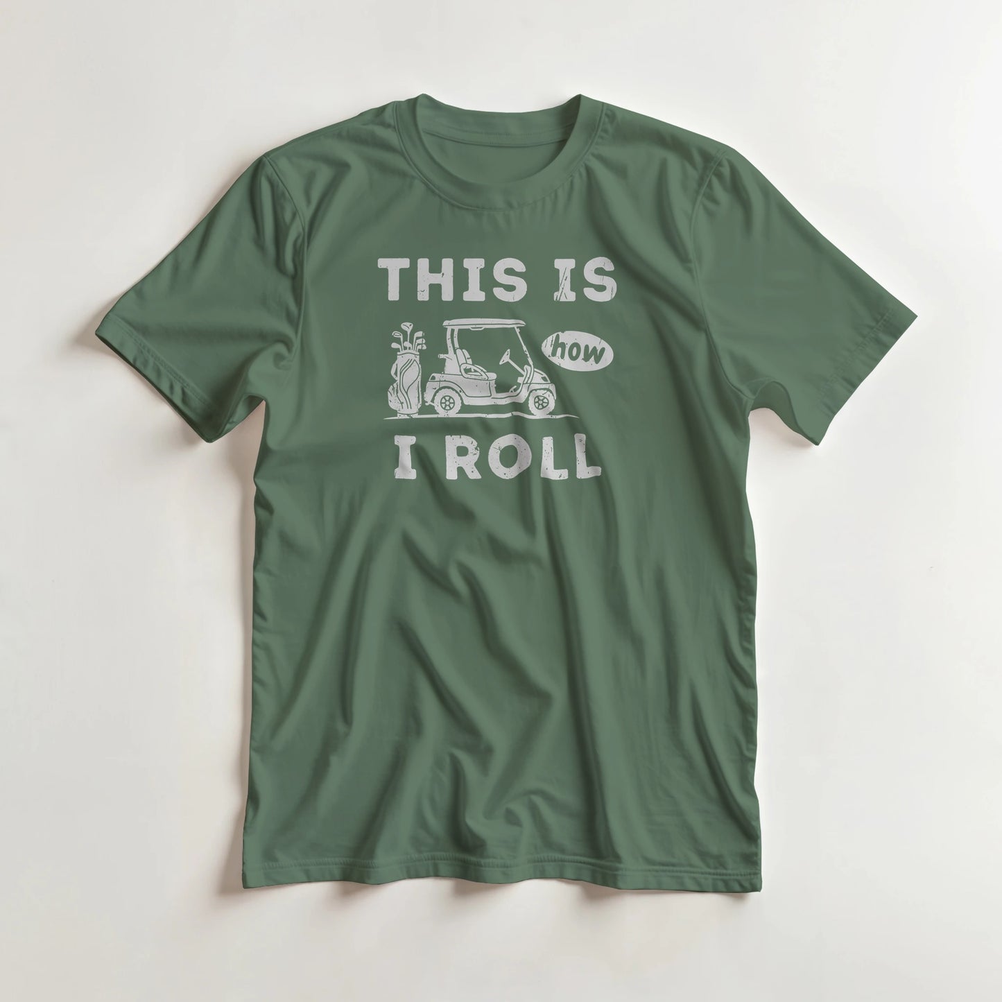 How I Roll T-Shirt in Military Green lying on a plain floor. T-shirt is a unisex cut and 100 per cent cotton.