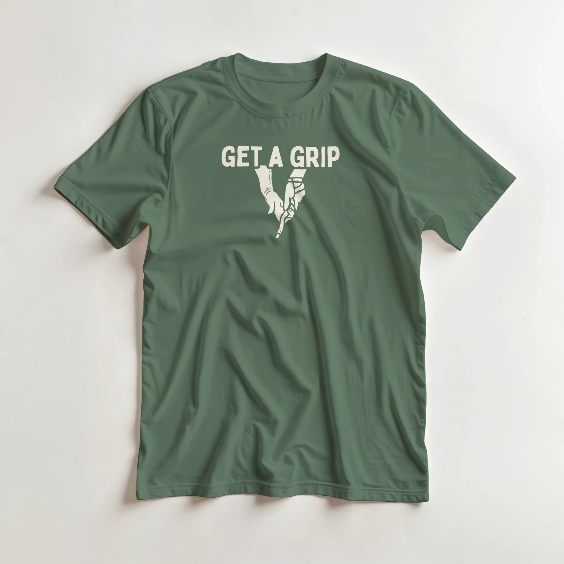 Get A Grip T-Shirt in Military Green S lying on a plain floor. T-shirt is a unisex cut and 100 per cent cotton.