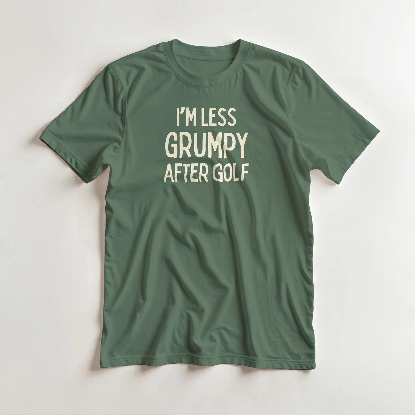 I'm Less Grumpy After Golf T-Shirt in Military Green lying on a plain floor. T-shirt is a unisex cut and 100 per cent cotton.