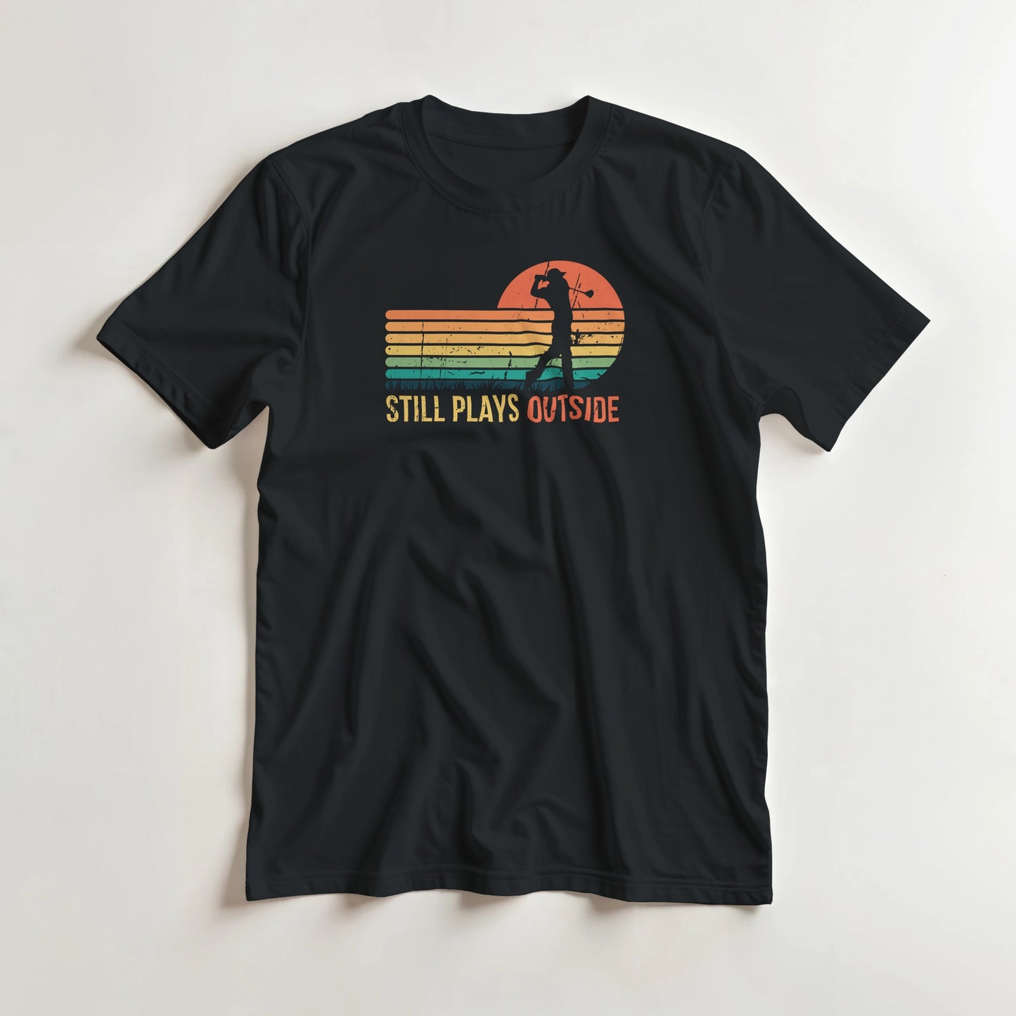 Plays Outside T-Shirt in Black XL lying on a plain floor. T-shirt is a unisex cut and 100 per cent cotton.