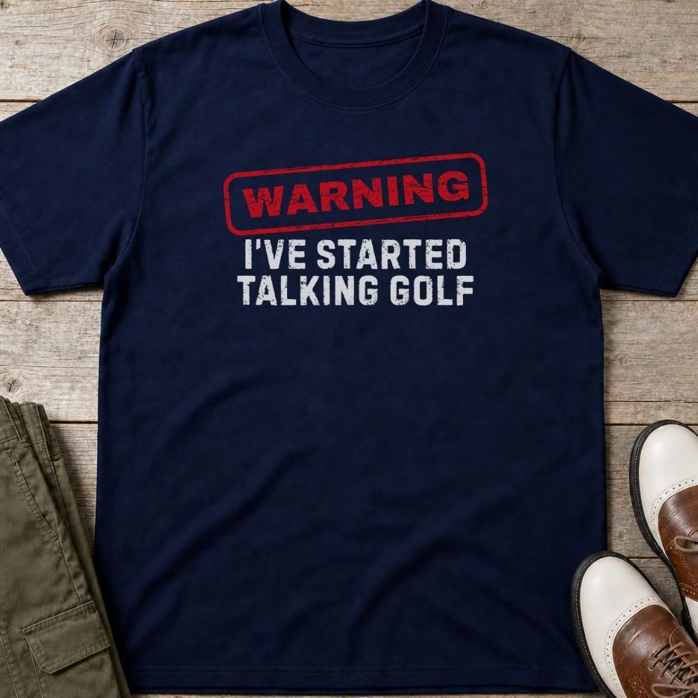 Talking Golf T-Shirt in Navy lying on a plain floor. T-shirt is a unisex cut and 100 per cent cotton.