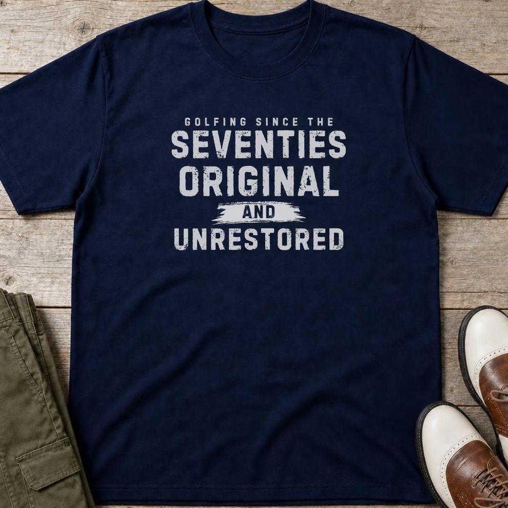 Unrestored 70s T-Shirt in Navy lying on a plain floor. T-shirt is a unisex cut and 100 per cent cotton.