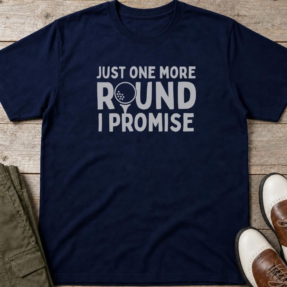 One More Round T-Shirt in Navy lying on a plain floor. T-shirt is a unisex cut and 100 per cent cotton.