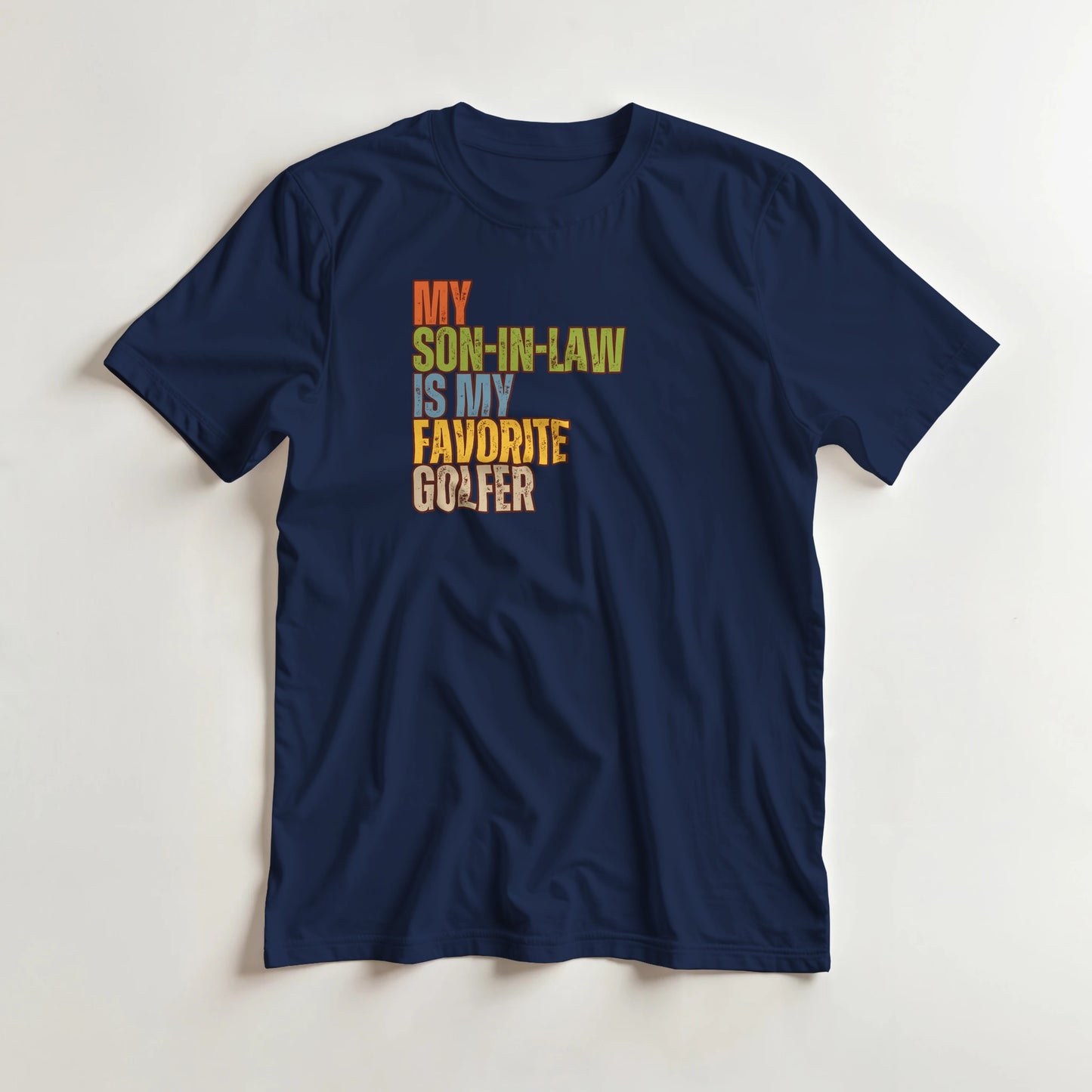 Son-In-Law T-Shirt in Navy lying on a plain floor. T-shirt is a unisex cut and 100 per cent cotton.