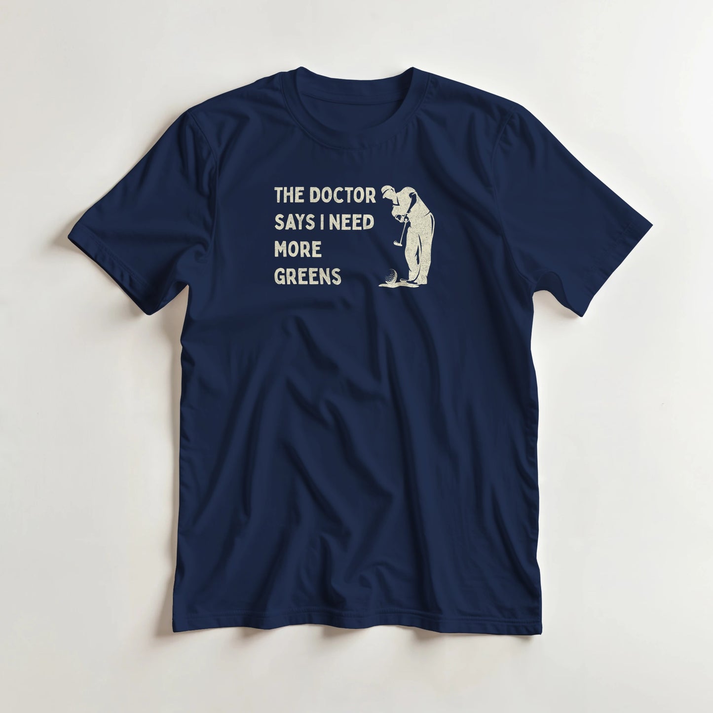 More Greens T-Shirt in Navy lying on a plain floor. T-shirt is a unisex cut and 100 per cent cotton.