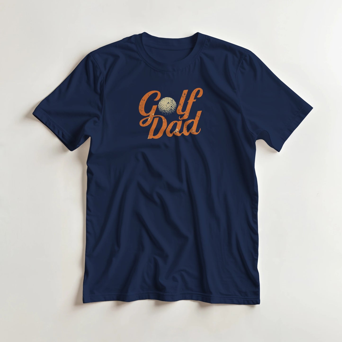 Golf Dad II T-Shirt in Navy L lying on a plain floor. T-shirt is a unisex cut and 100 per cent cotton.