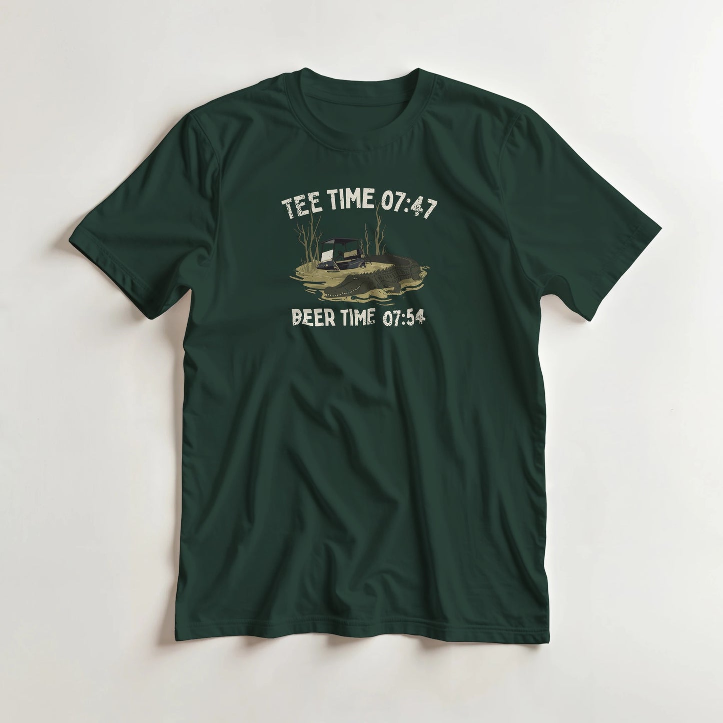 Tee Time 07:47 T-Shirt in Forest Green lying on a plain floor. T-shirt is a unisex cut and 100 per cent cotton.