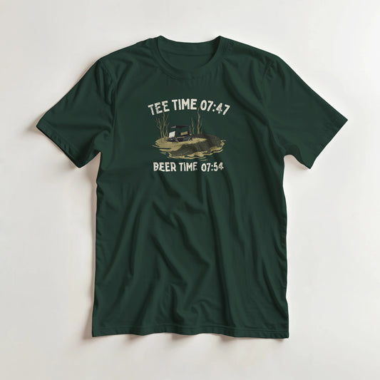 Tee Time 07:47 T-Shirt in Forest Green lying on a plain floor. T-shirt is a unisex cut and 100 per cent cotton.