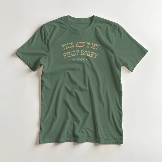 First Bogey T-Shirt in Military Green lying on a plain floor. T-shirt is a unisex cut and 100 per cent cotton.