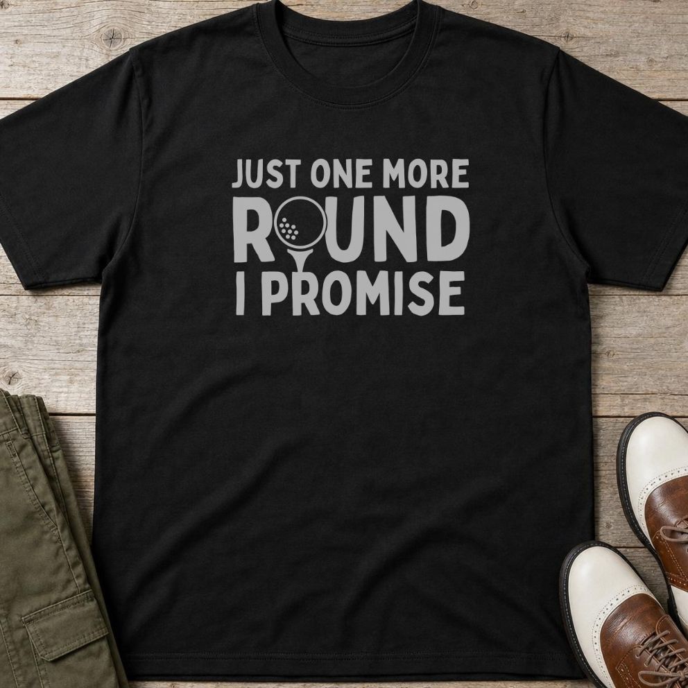 One More Round T-Shirt in Black lying on a plain floor. T-shirt is a unisex cut and 100 per cent cotton.