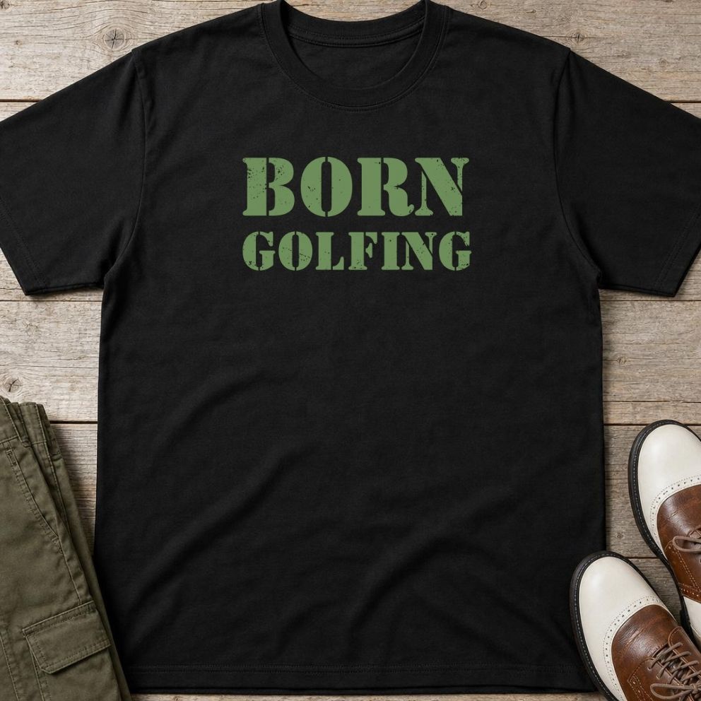Born Golfing T-Shirt in Black lying on a plain floor. T-shirt is a unisex cut and 100 per cent cotton.