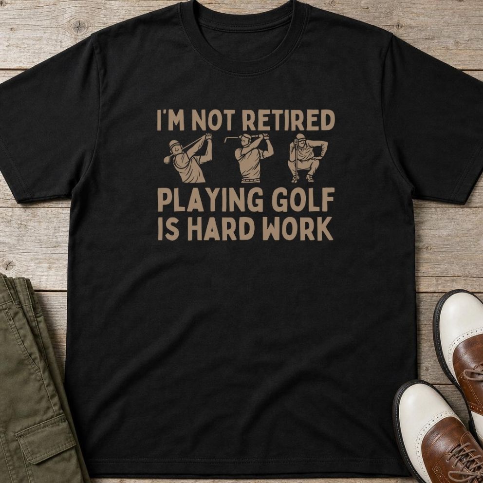 Hard Work T-Shirt in Black lying on a plain floor. T-shirt is a unisex cut and 100 per cent cotton.