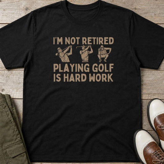 Hard Work T-Shirt in Black lying on a plain floor. T-shirt is a unisex cut and 100 per cent cotton.