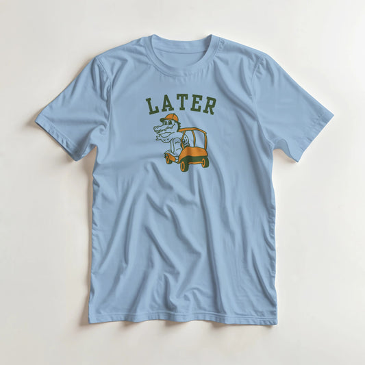 Later Gator T-Shirt in Light Blue lying on a plain floor. T-shirt is a unisex cut and 100 per cent cotton.