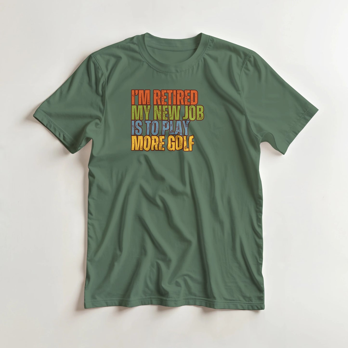 I'm Retired T-Shirt in Military Green XL lying on a plain floor. T-shirt is a unisex cut and 100 per cent cotton.