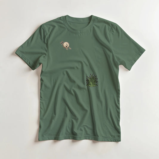 Flying Into Rough T-Shirt in Military Green lying on a plain floor. T-shirt is a unisex cut and 100 per cent cotton.