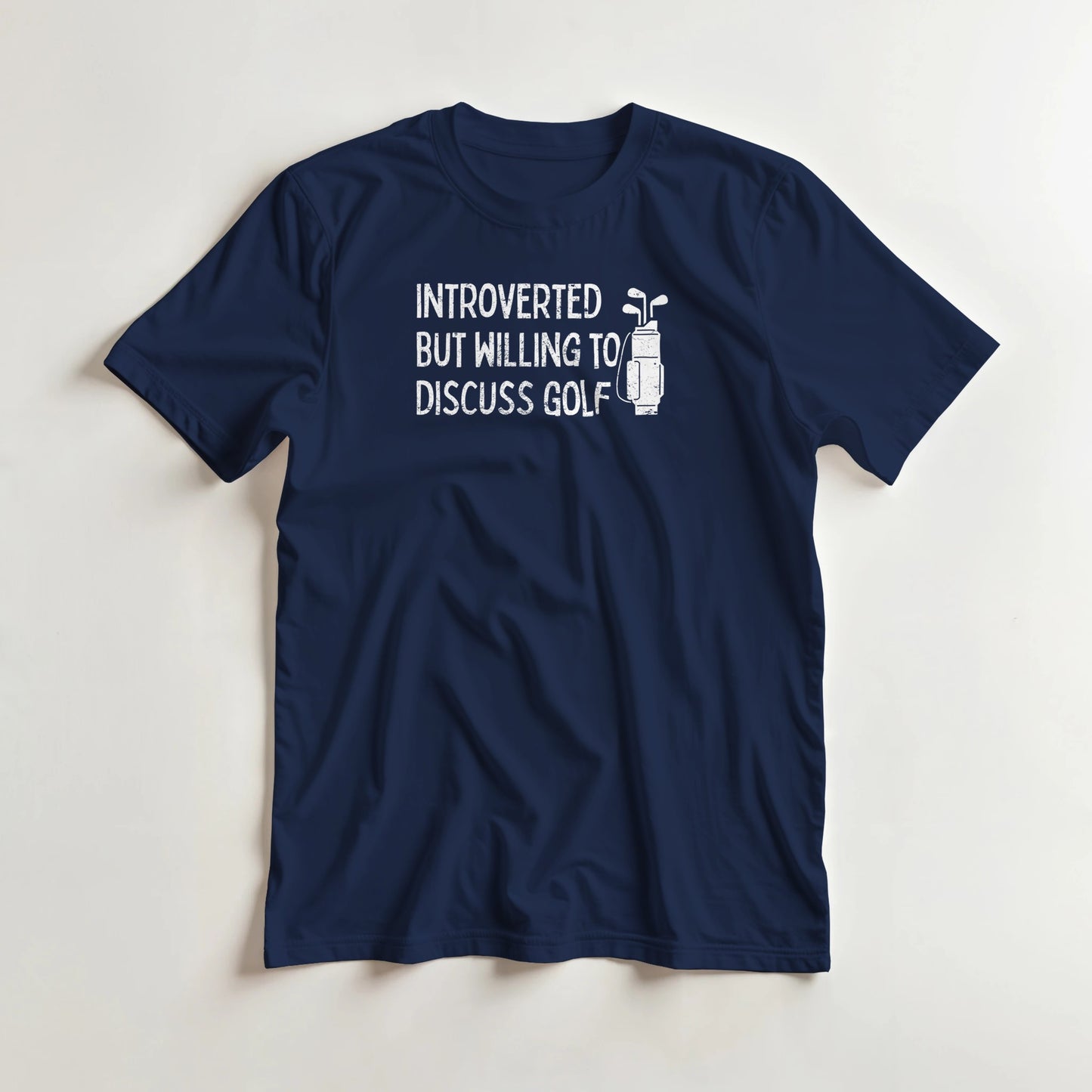 Introverted T-Shirt in Navy lying on a plain floor. T-shirt is a unisex cut and 100 per cent cotton.