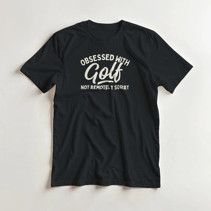 Obsessed With Golf T-Shirt in Black lying on a plain floor. T-shirt is a unisex cut and 100 per cent cotton.