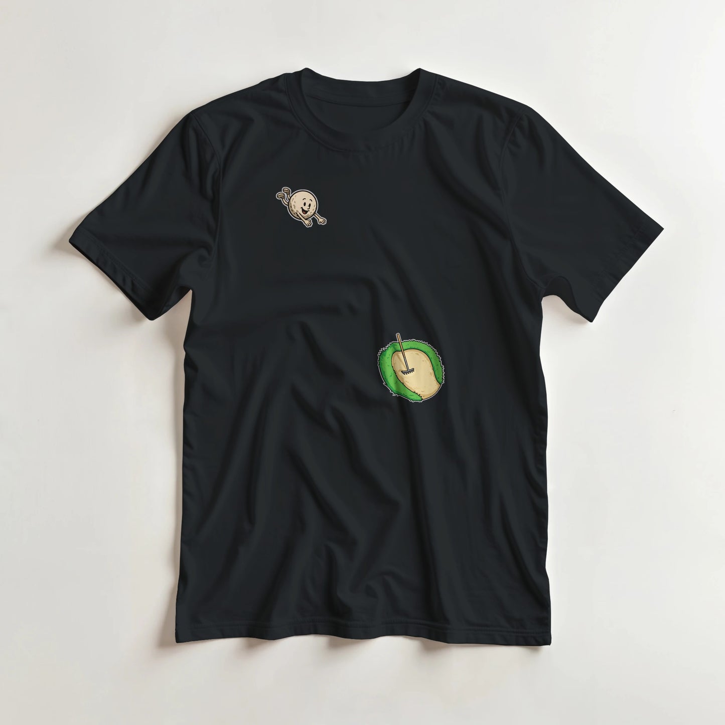 Flying Sand Trap T-Shirt in Black lying on a plain floor. T-shirt is a unisex cut and 100 per cent cotton.