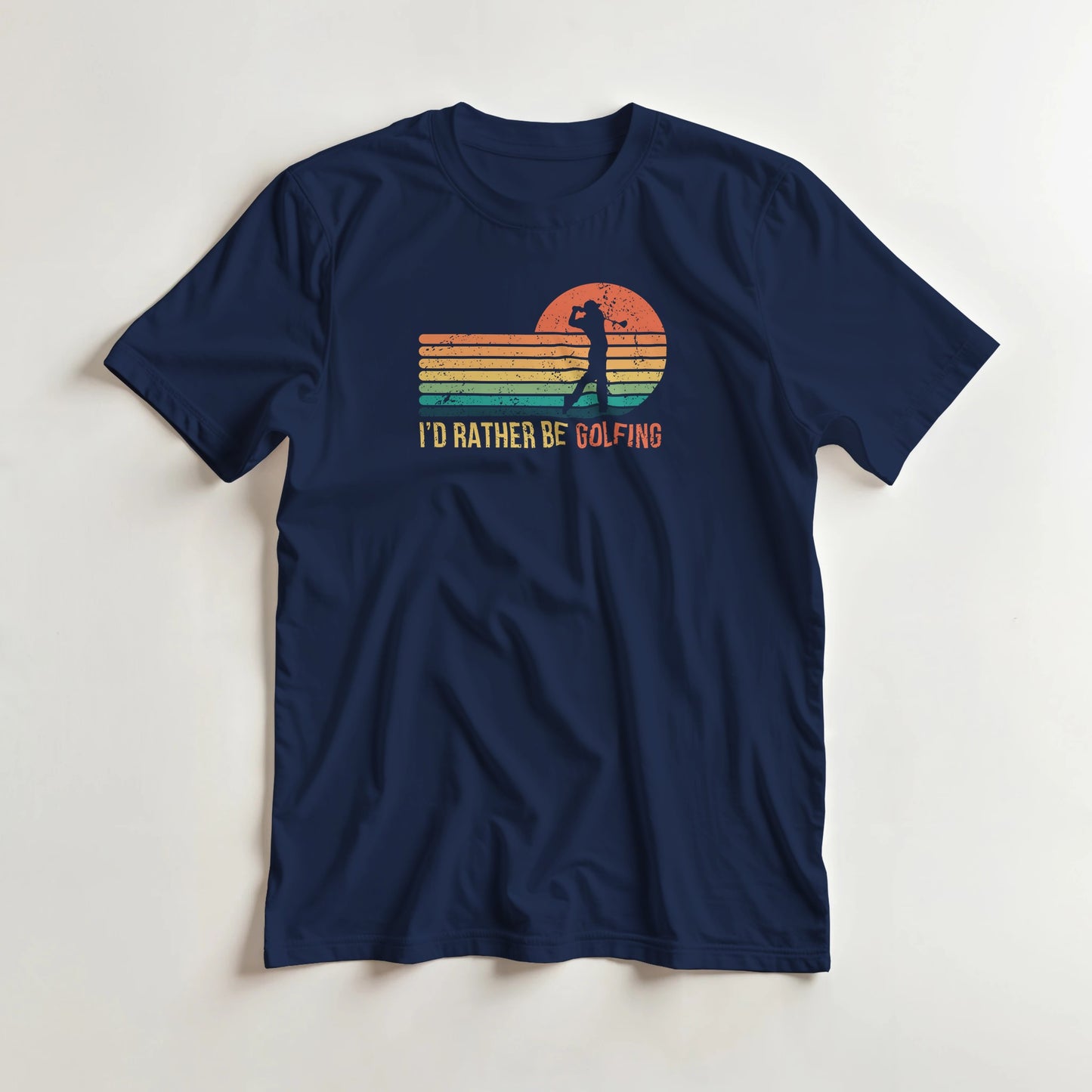 Rather Be Golfing T-Shirt in Navy S lying on a plain floor. T-shirt is a unisex cut and 100 per cent cotton.