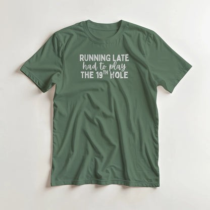 Running Late T-Shirt in Military Green lying on a plain floor. T-shirt is a unisex cut and 100 per cent cotton.