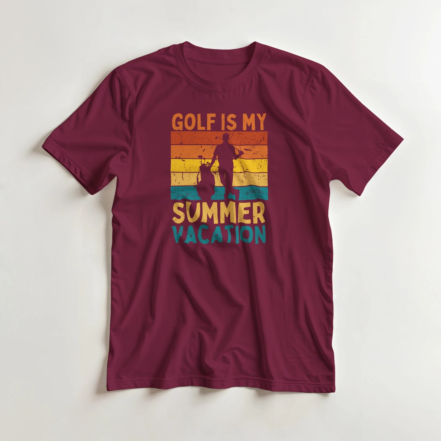 Summer Vacation T-Shirt in Maroon lying on a plain floor. T-shirt is a unisex cut and 100 per cent cotton.